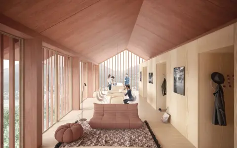 Intérieur lumineux d'un logement étudiant suisse en bois, avec vue sur les montagnes. Un espace convivial pour étudier et se détendre.
