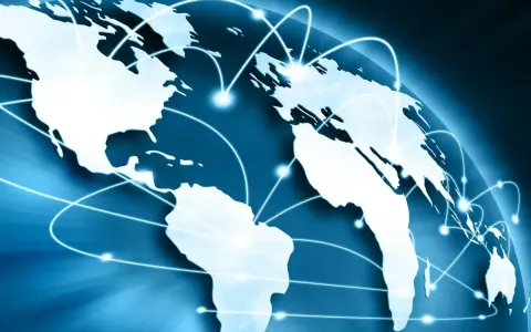 Carte du monde bleue avec des lignes lumineuses connectant les continents, symbolisant le commerce international et un futur doctorat.