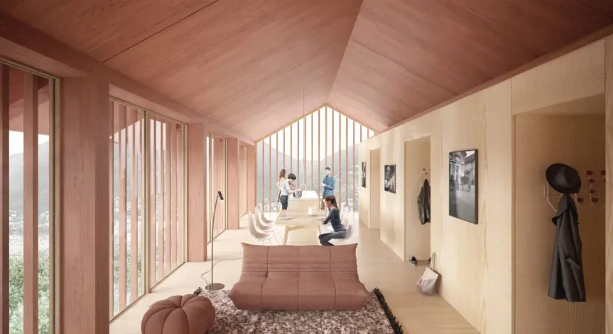 Intérieur lumineux d'un logement étudiant suisse en bois, avec vue sur les montagnes. Un espace convivial pour étudier et se détendre.